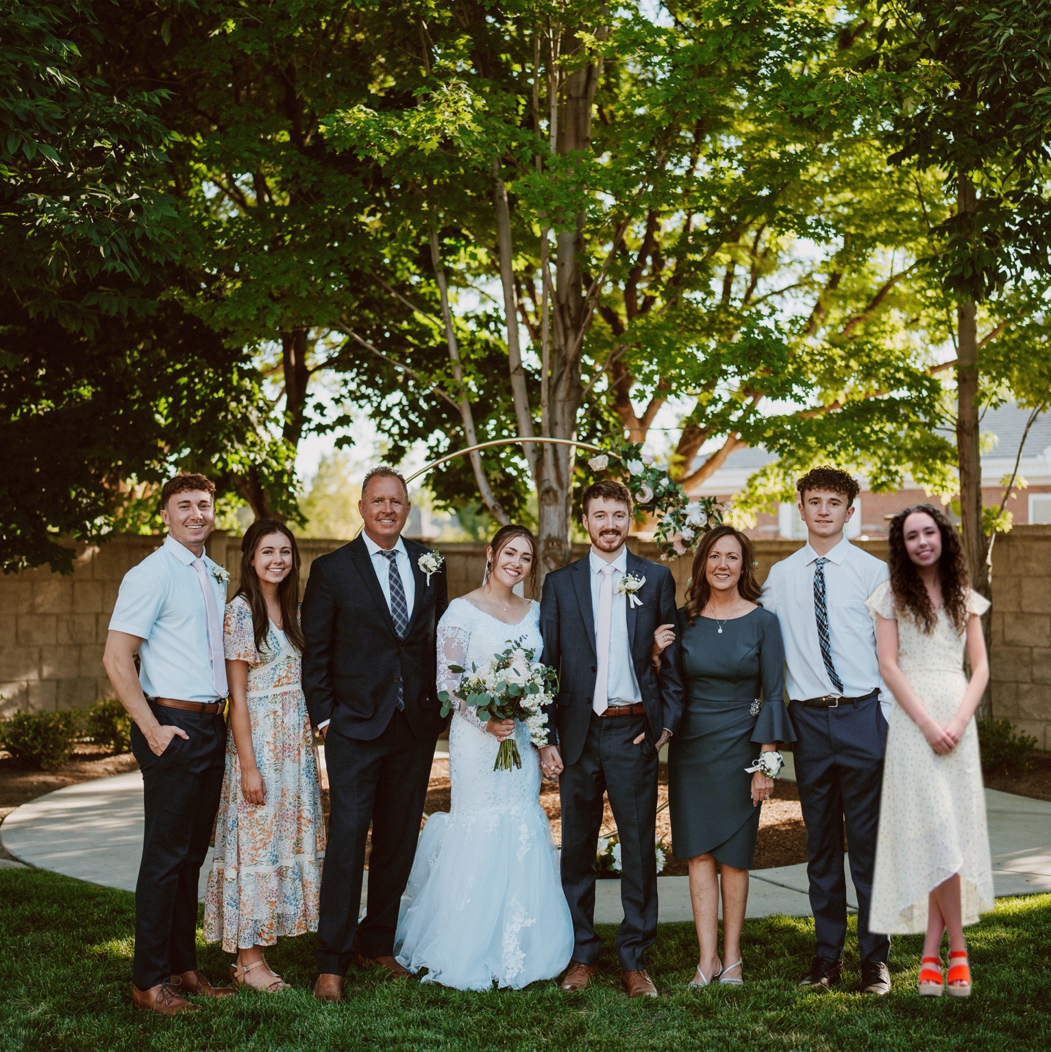 Jeff with family at an outdoor wedding