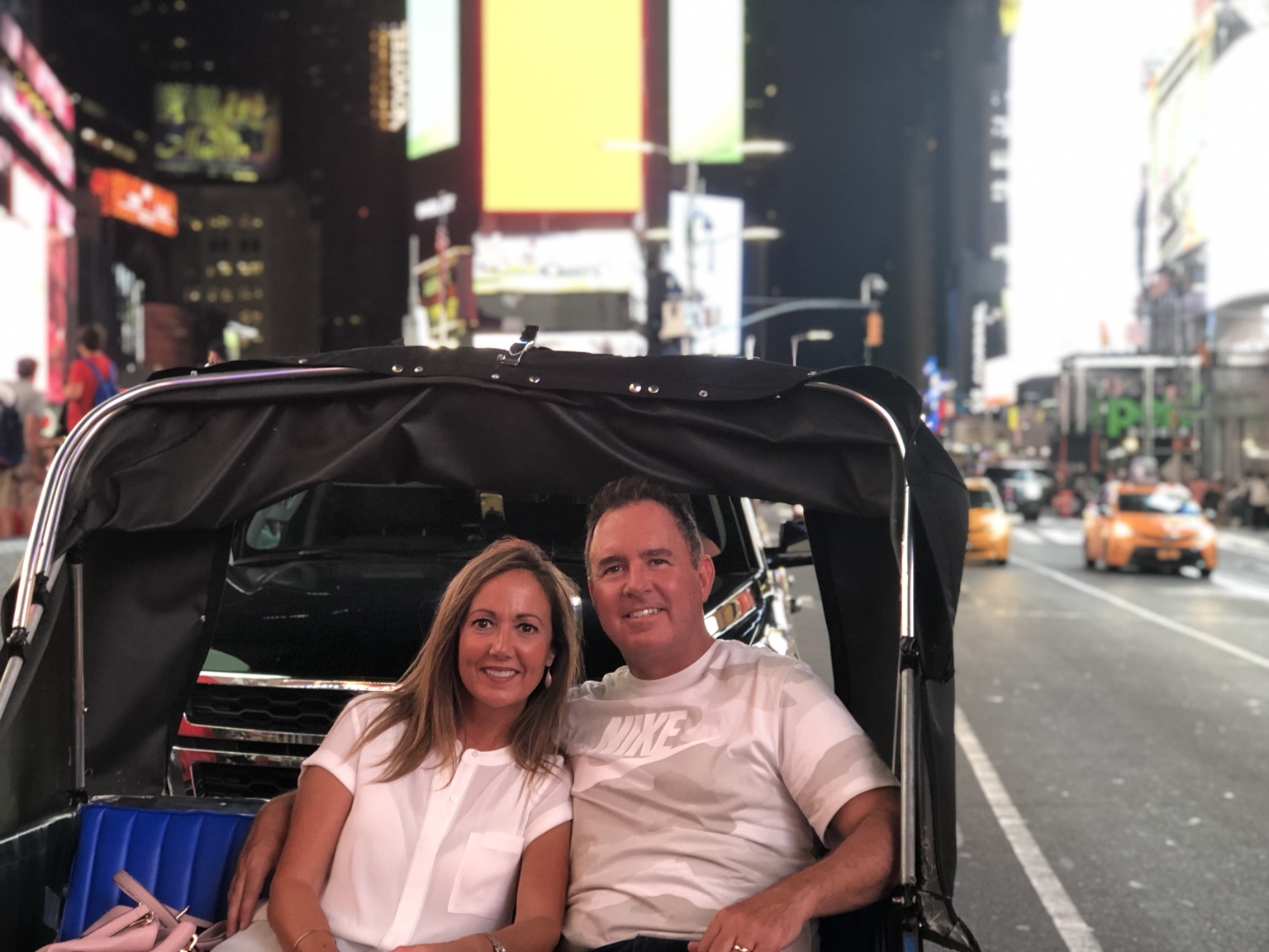 Jeff and a companion enjoying a ride in Times Square